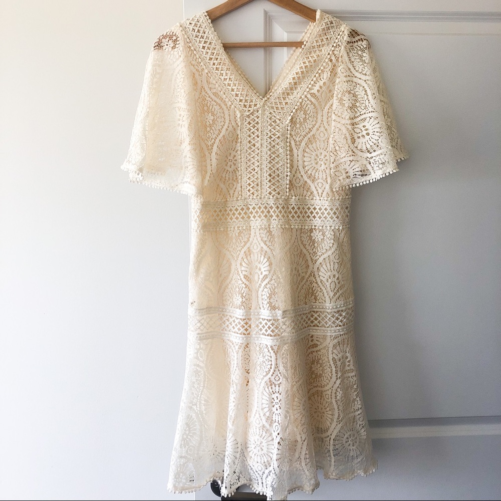 Lace flared dress with flutter cape sleeves